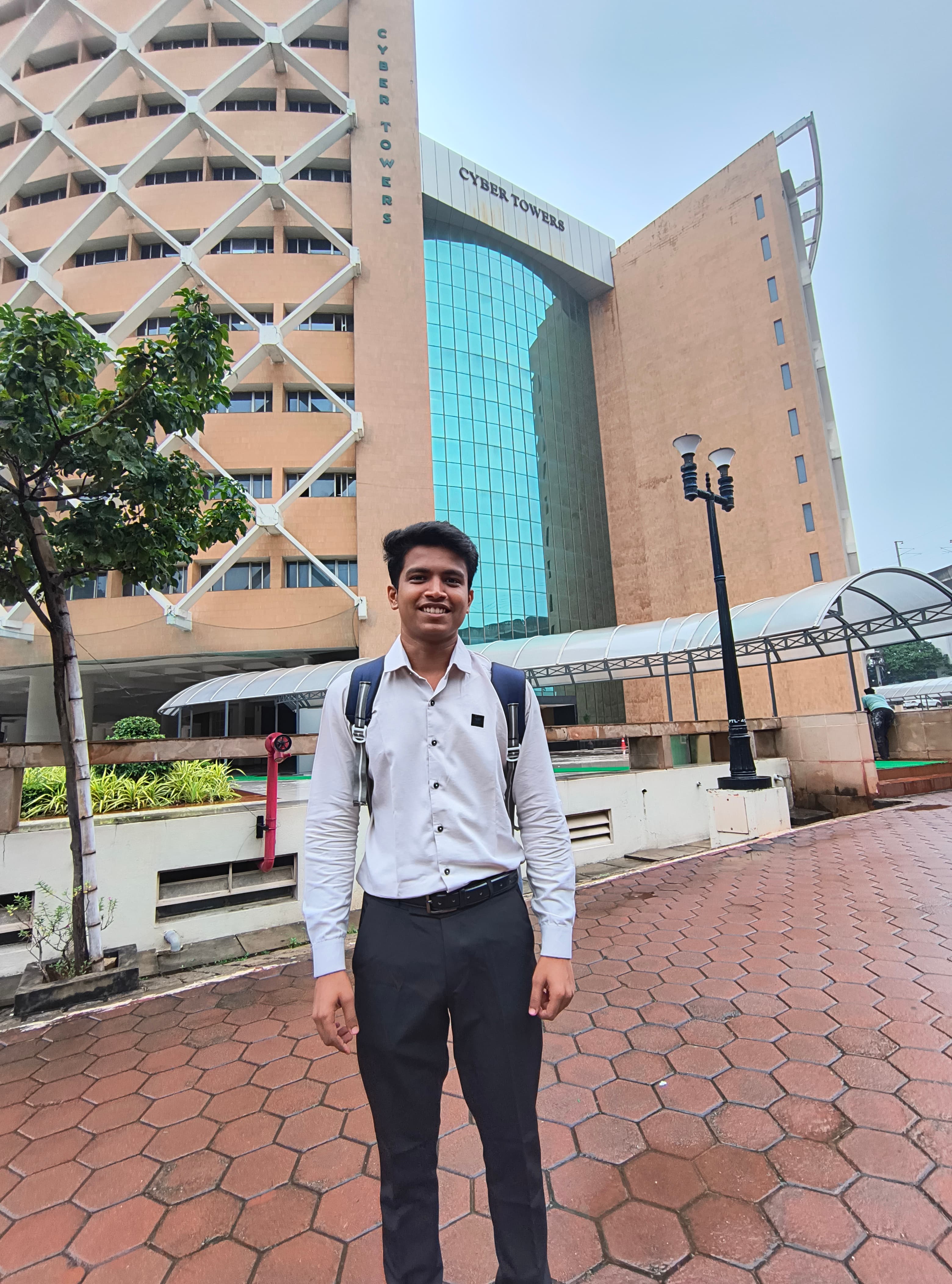Prathamesh Kasar with a backpack outside an office building
