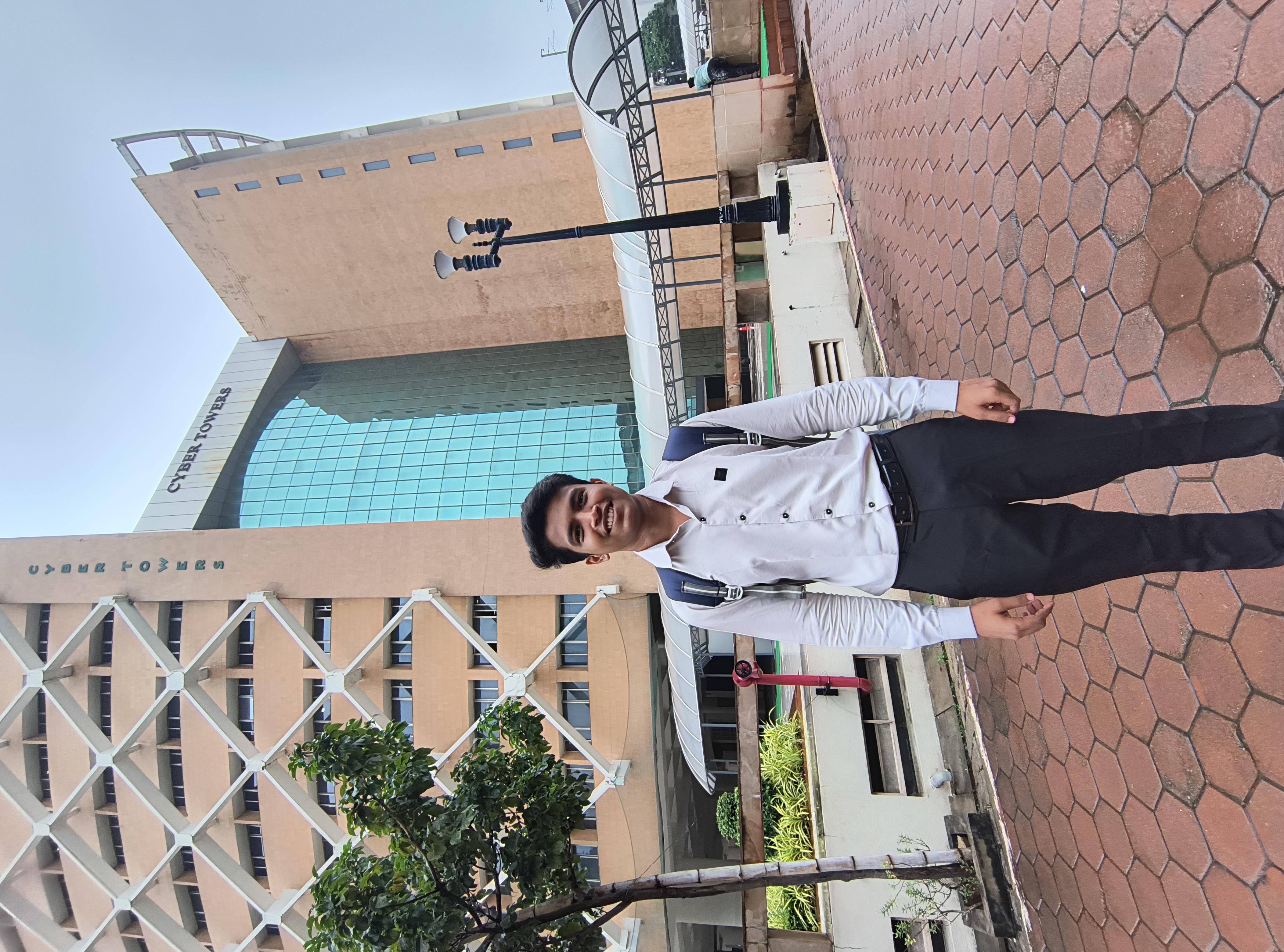 Prathamesh Kasar with a backpack outside an office building