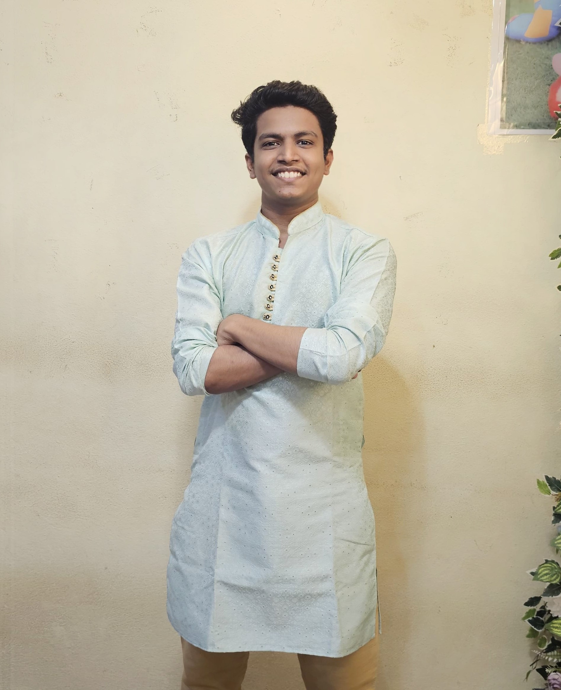 Prathamesh Kasar in a light kurta, arms folded