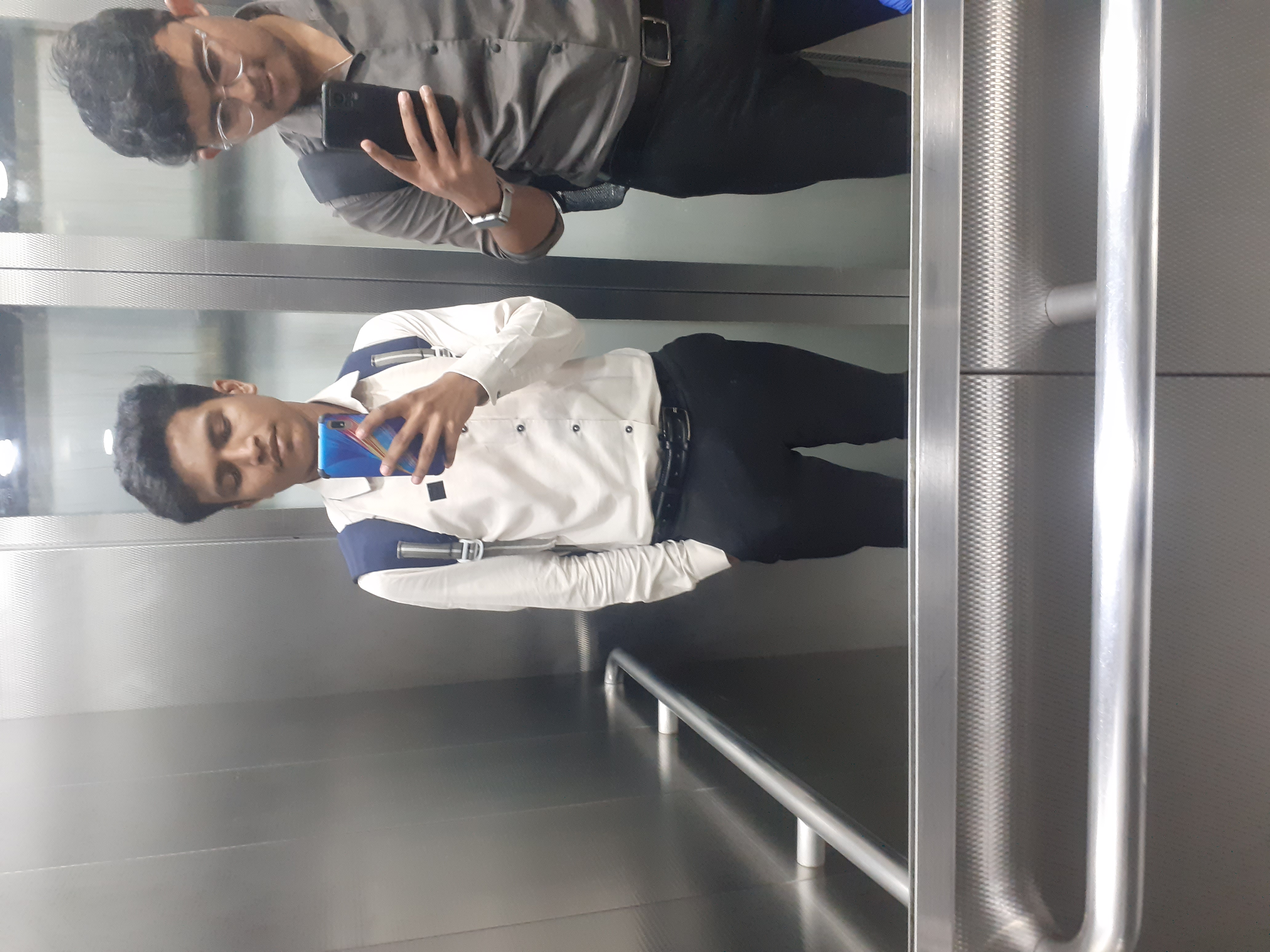 Prathamesh Kasar taking a mirror selfie in a lift