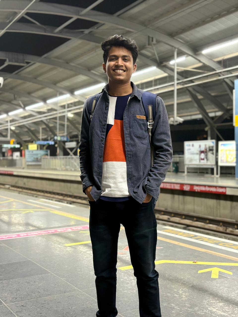 Prathamesh Kasar standing on a metro station platform